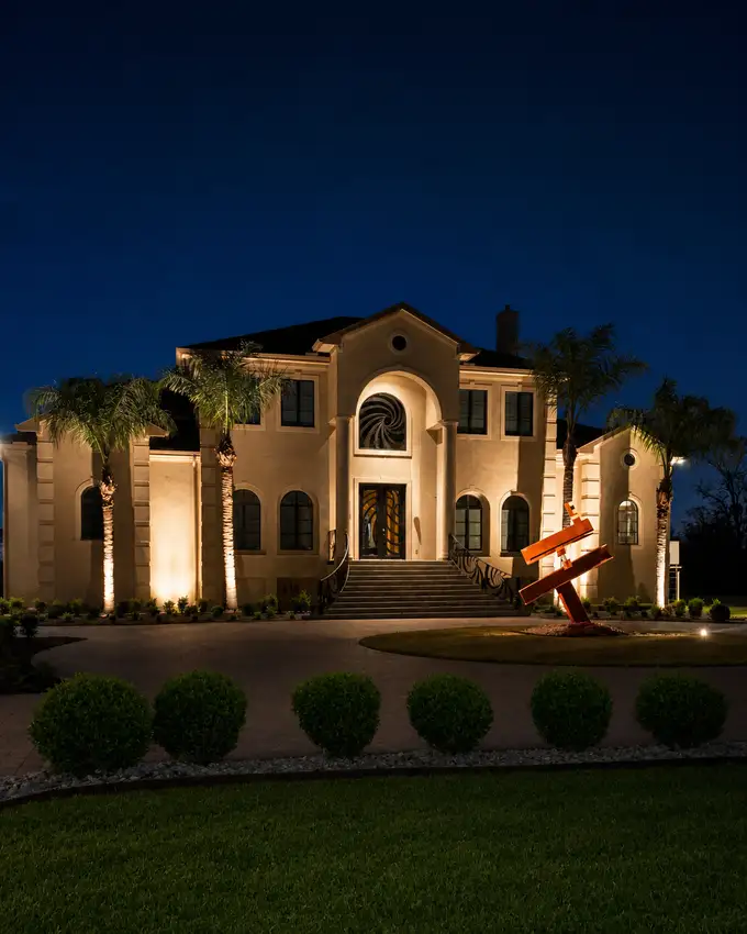 Estate facade with architectural and tree uplighting — Landscape Lighting